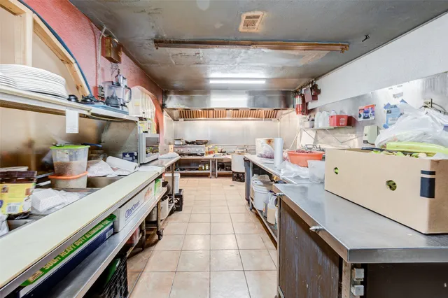 a bathroom with a sink mirror toilet and shower
