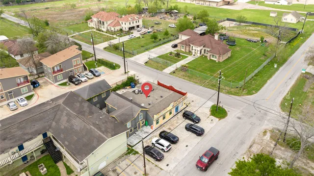 an aerial view of a house with a swimming pool
