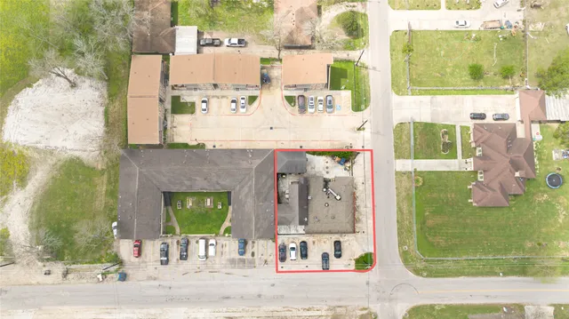 an aerial view of a house with a swimming pool