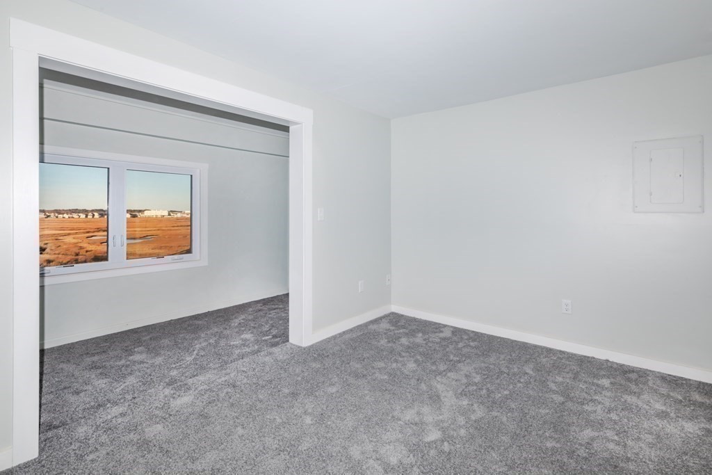 449 Ocean Boulevard, Unit 305 Hampton, NH 03842 - Photo 19 of 28 an empty room with a window
