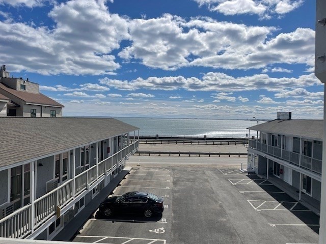 449 Ocean Boulevard, Unit 305 Hampton, NH 03842 - Photo 26 of 28 a view of a balcony with an ocean