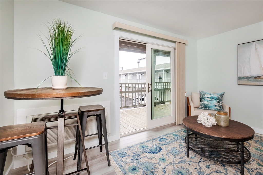 449 Ocean Boulevard, Unit 305 Hampton, NH 03842 - Photo 8 of 28 a living room with furniture