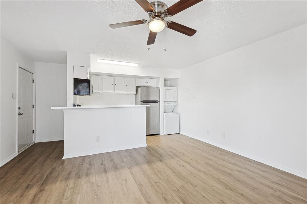 9839 Walnut Street, Unit 306 Dallas, TX 75243 - Photo 27 of 32 a view of kitchen with wooden floor and electronic appliances