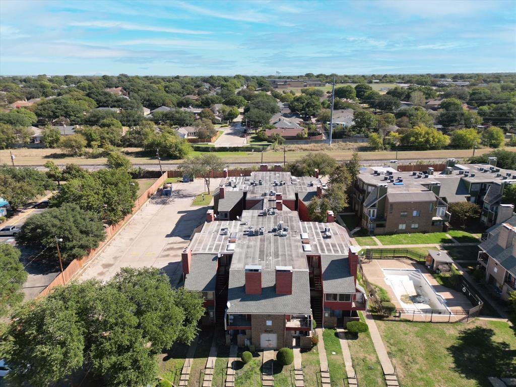 9839 Walnut Street, Unit 306 Dallas, TX 75243 - Photo 31 of 32 a view of multiple houses with yard
