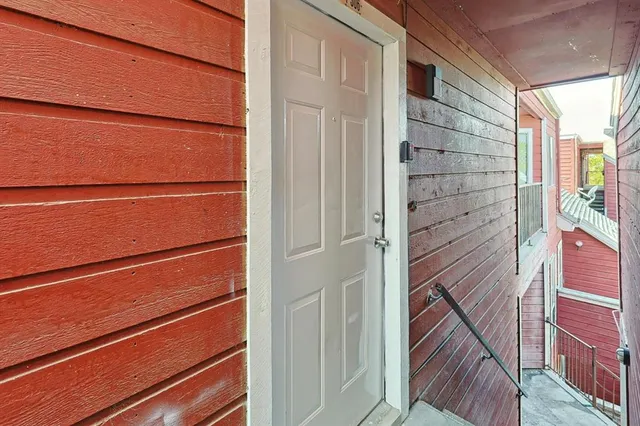 a view of bathroom with a glass door and a window