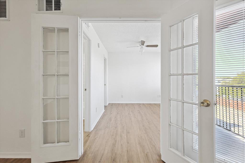 9839 Walnut Street, Unit 306 Dallas, TX 75243 - Photo 6 of 32 a view of a closet area with empty room
