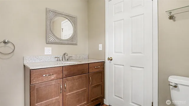 a bathroom with 2 sink and a mirror