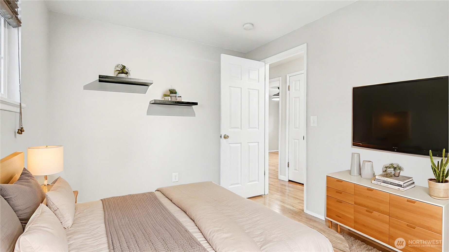 6201 Island Crest Way Mercer Island, WA 98040 - Photo 22 of 40 a bedroom with a bed and a flat screen tv