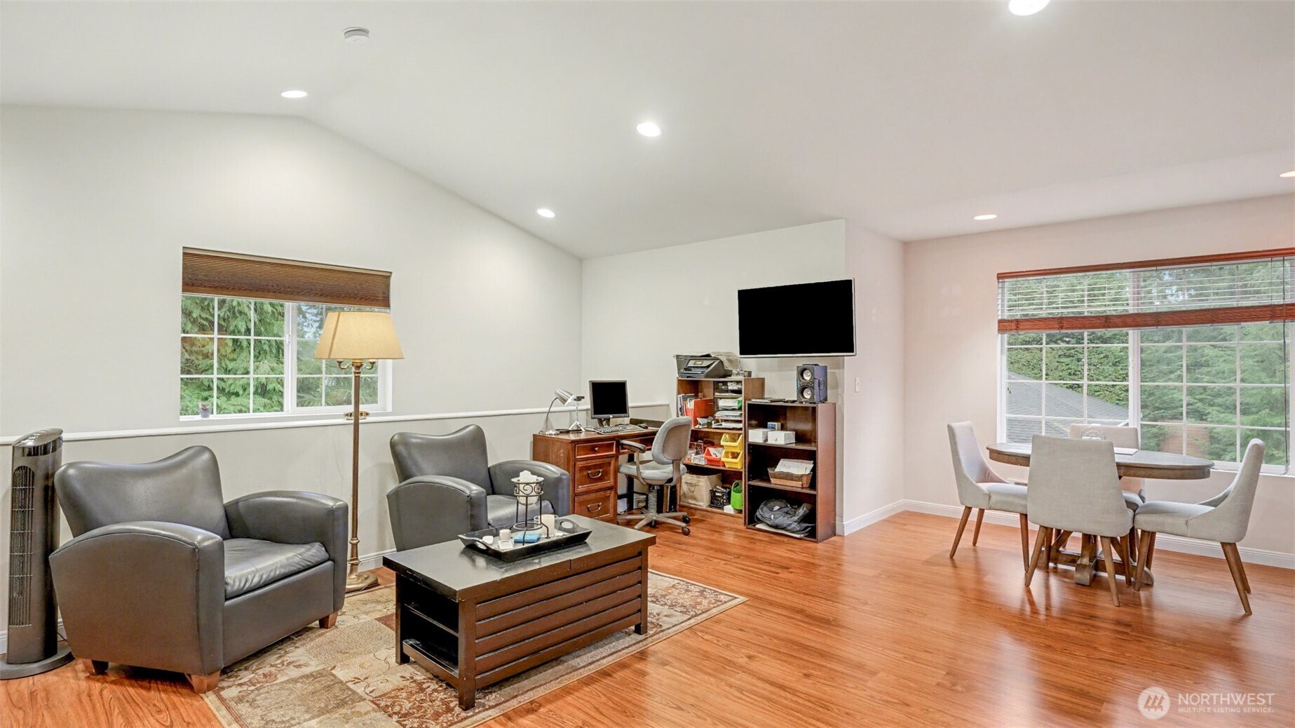 6201 Island Crest Way Mercer Island, WA 98040 - Photo 26 of 40 a living room with furniture and a flat screen tv