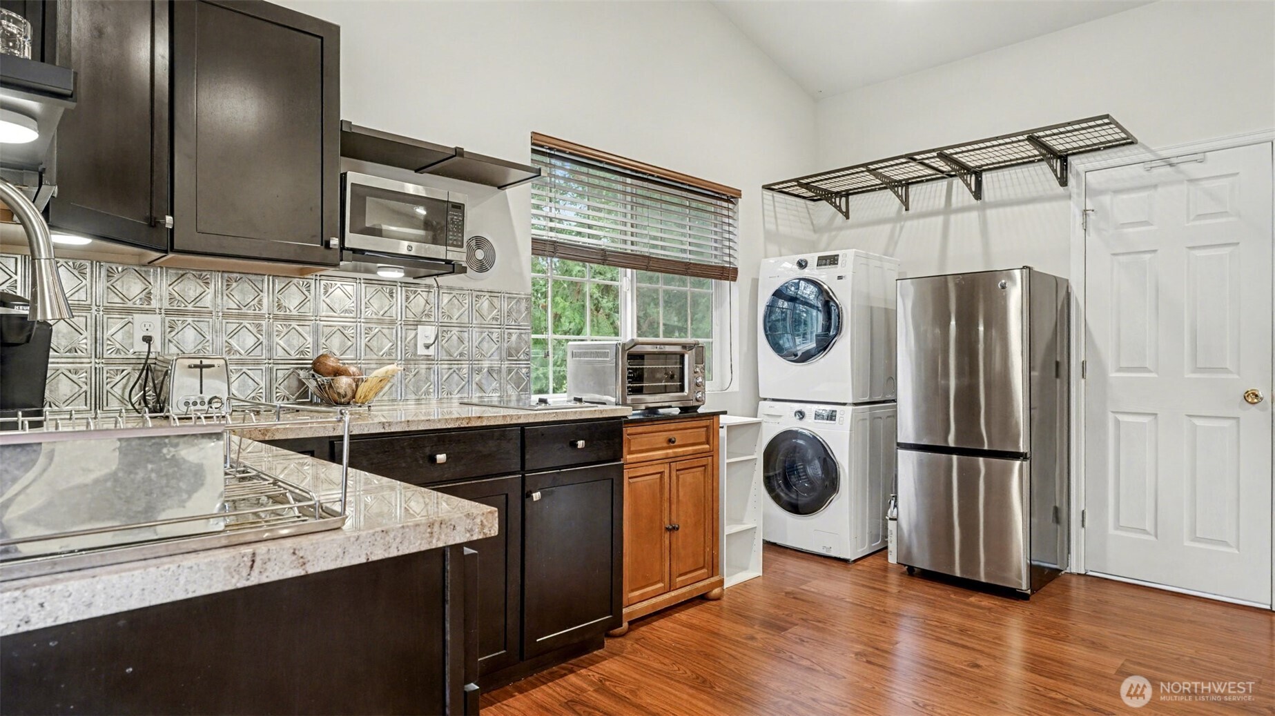 6201 Island Crest Way Mercer Island, WA 98040 - Photo 28 of 40 a kitchen with stainless steel appliances granite countertop a refrigerator a sink and dishwasher