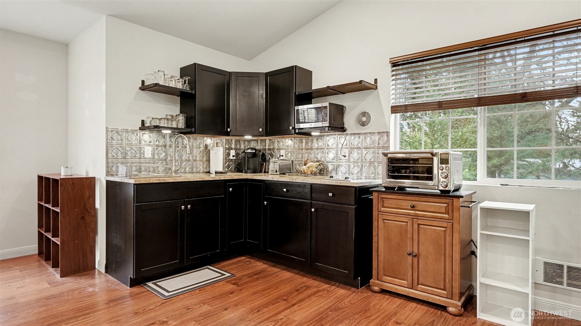 6201 Island Crest Way Mercer Island, WA 98040 - Photo 29 of 40 a kitchen with stainless steel appliances granite countertop a stove sink and cabinets