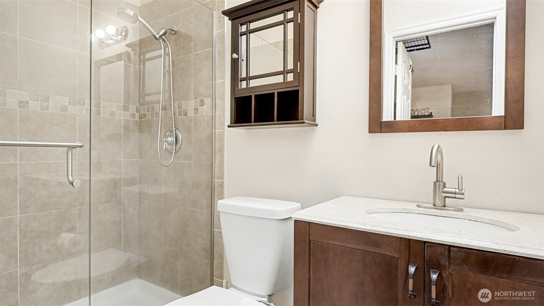 6201 Island Crest Way Mercer Island, WA 98040 - Photo 31 of 40 a bathroom with a sink a toilet and shower