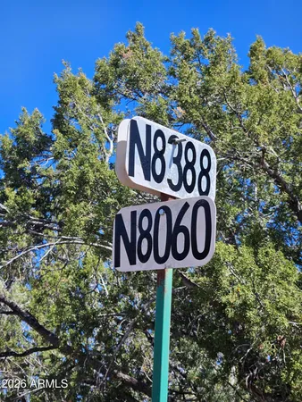 a view of a road with a building in the background