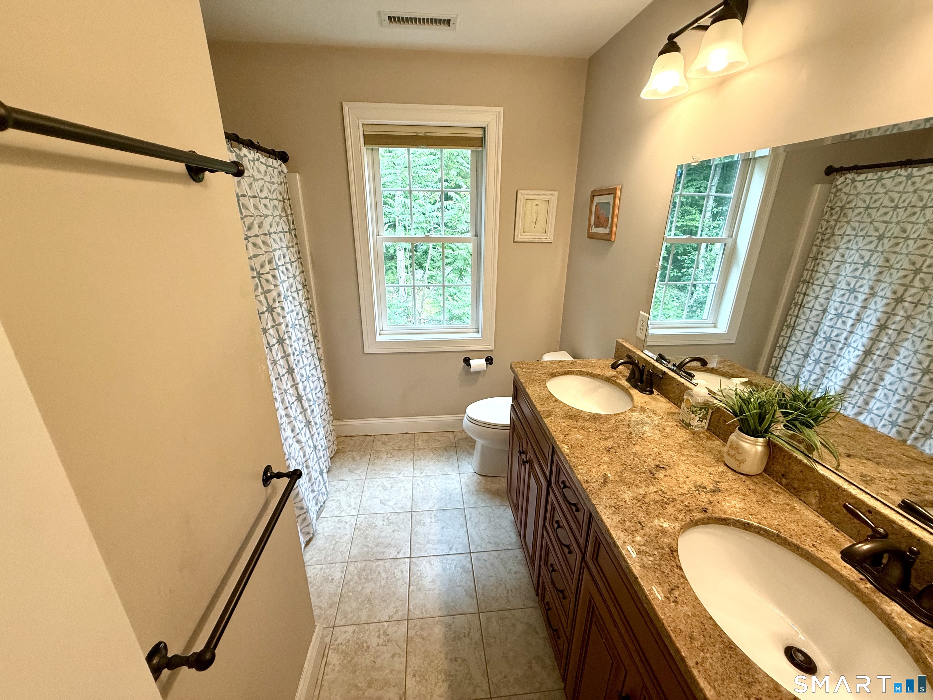 46 Hoseye Coach Road Newtown, CT 06482 - Photo 22 of 36 Freshly painted hall bath. Double sink vanity.