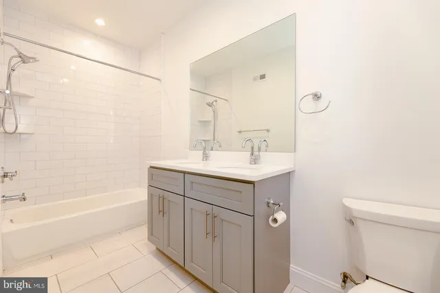 a view of a room with wooden floor and stairs
