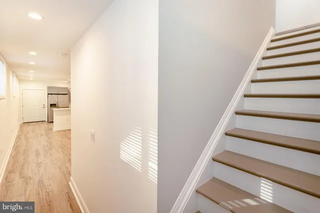 a kitchen with a sink cabinets and stainless steel appliances