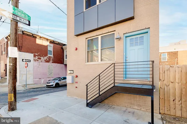 a front view of a building with a street