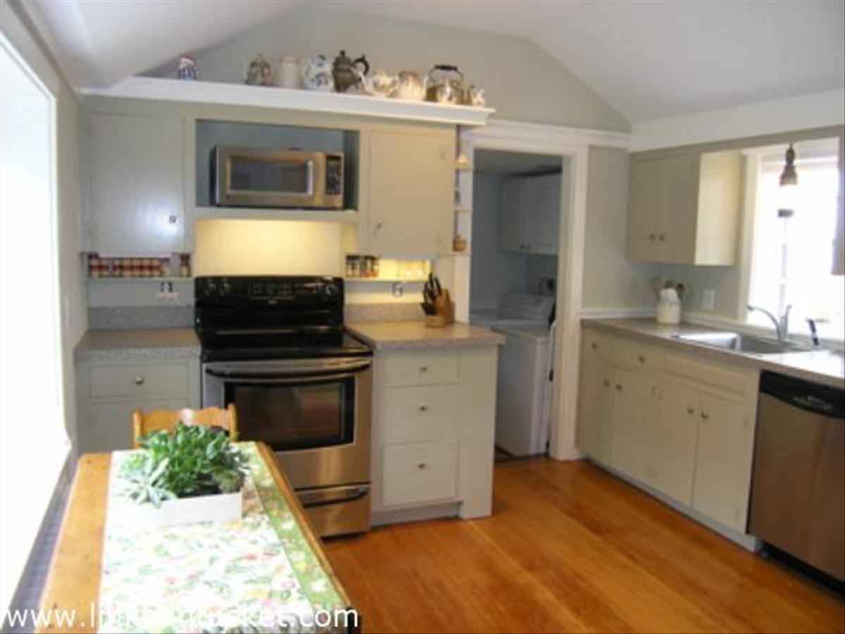 16 Vestal Street Nantucket, MA 02554 - Photo 8 of 10 a kitchen with a sink stove and microwave