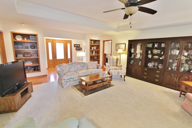 1615 Willow Road Morris, IL 60450 - Photo 8 of 25 a spacious bedroom with a bed couch and a flat tv screen