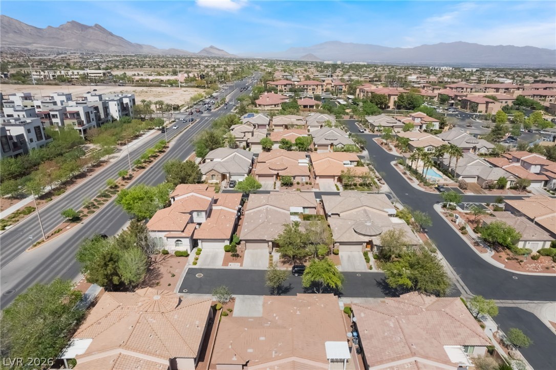 10481 Riverside Park Avenue Las Vegas, NV 89135 - Photo 42 of 51 Rear aerial perspective of subject property and community with a mountainous background