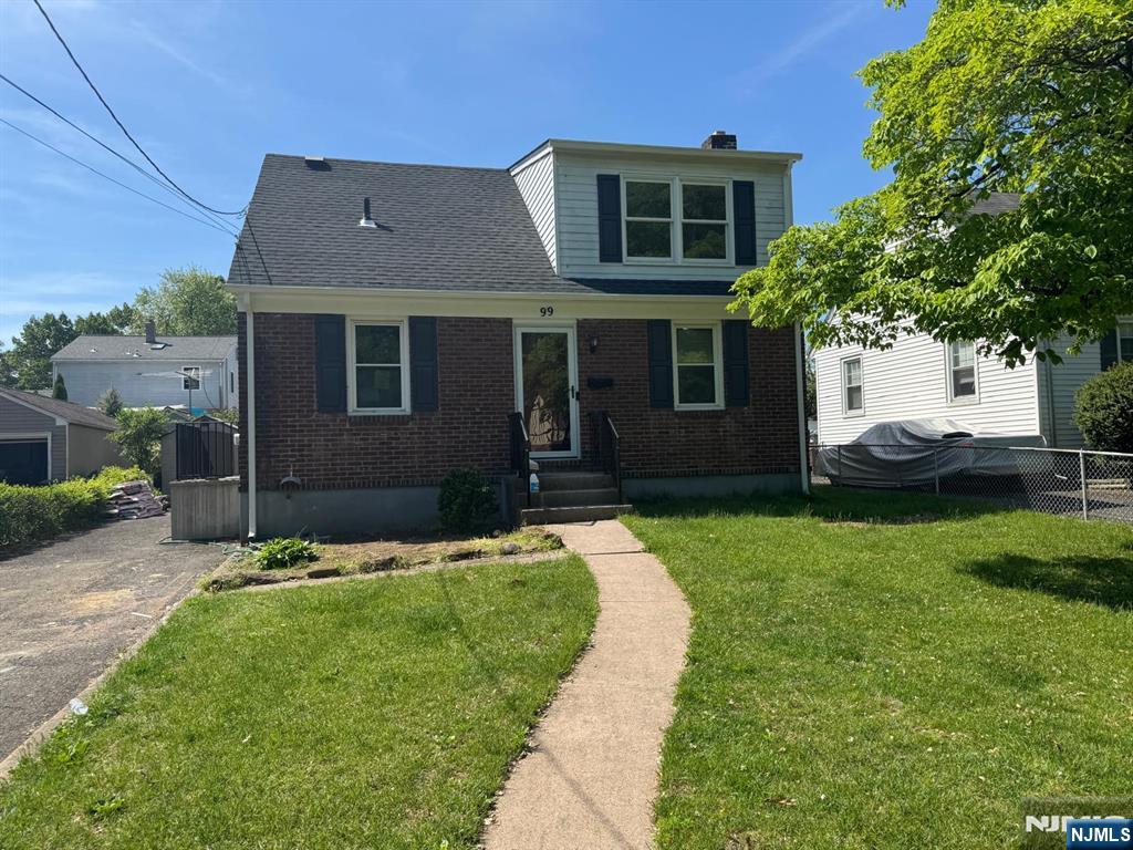 a view of house with yard