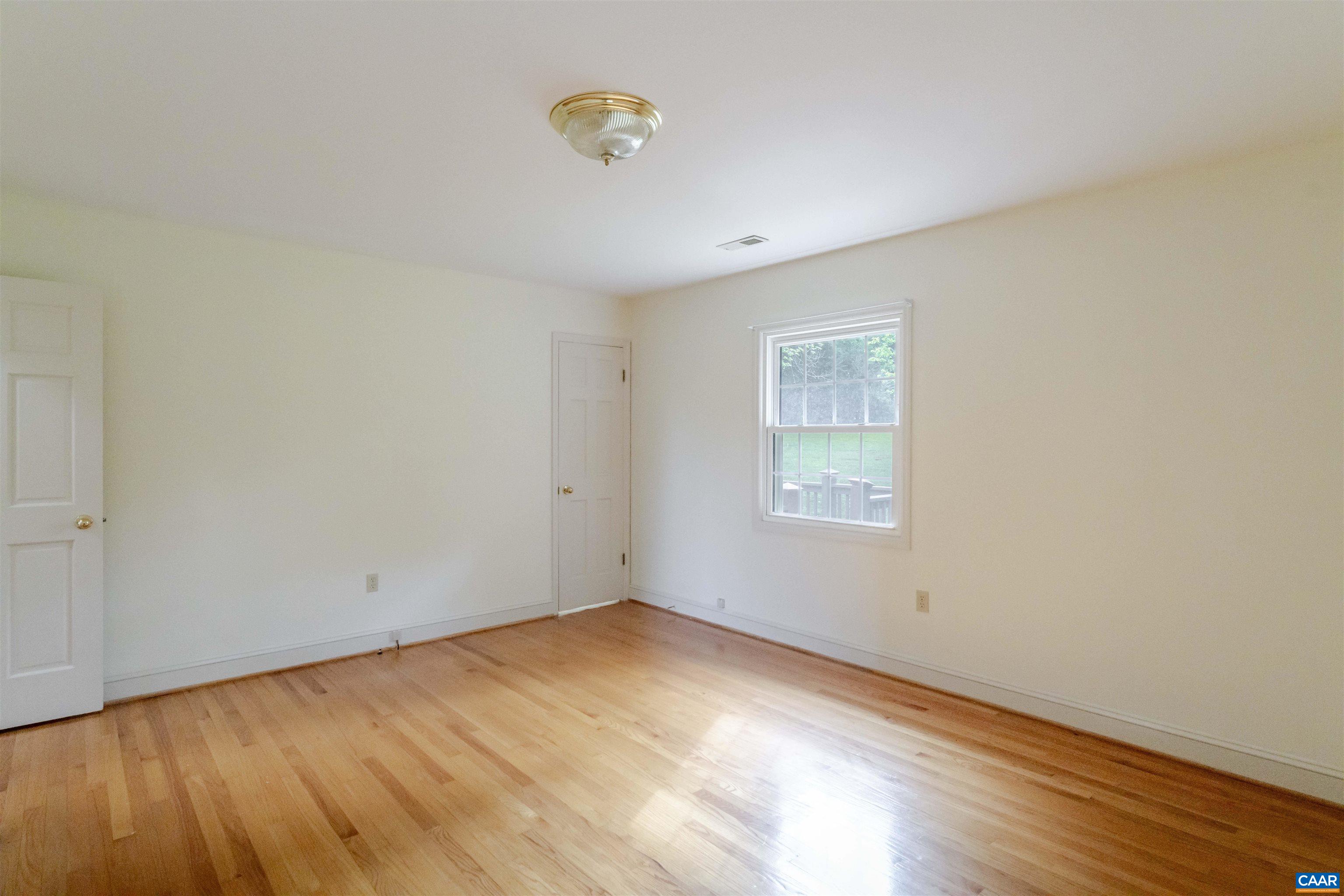 1813 Stony Point Road Charlottesville, VA 22911 - Photo 19 of 40 a view of empty room with wooden floor and fan
