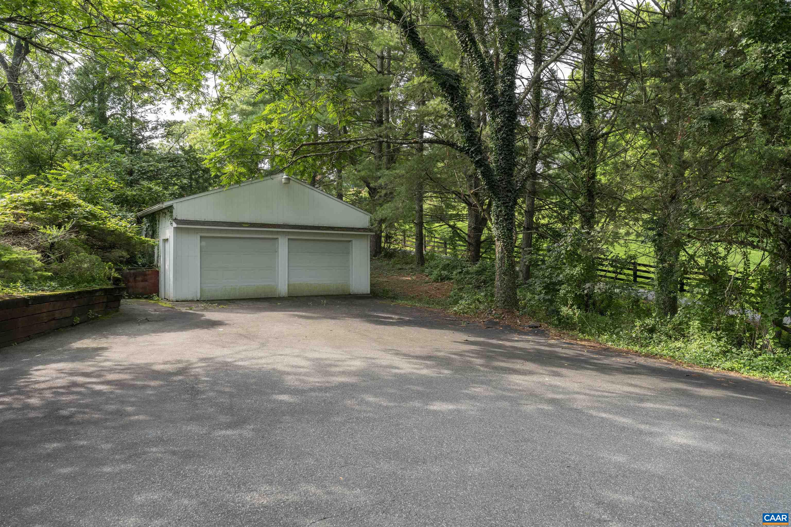 1813 Stony Point Road Charlottesville, VA 22911 - Photo 4 of 40 a front view of a house with a garden and tree