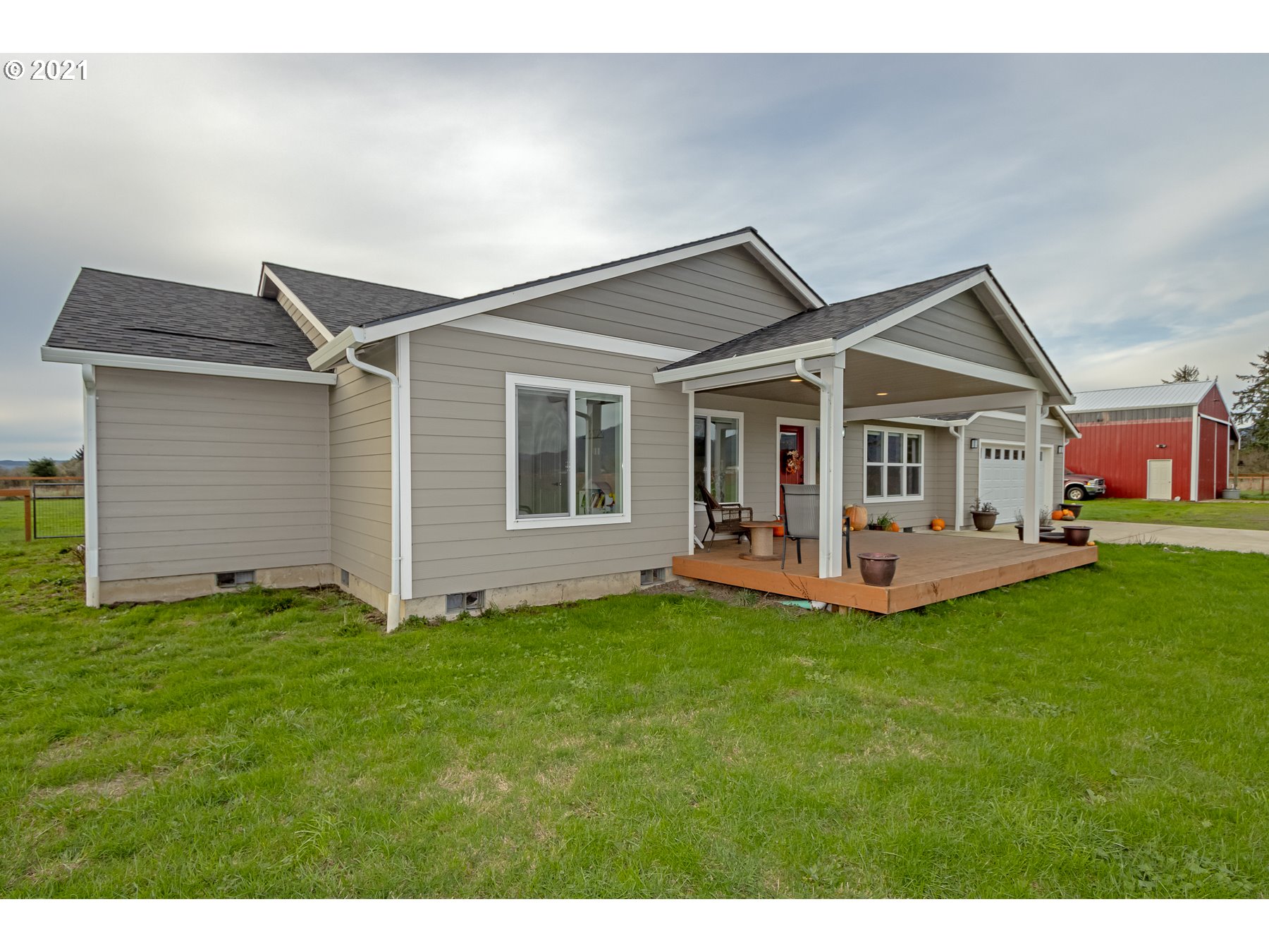 1200 McCormick Loop Road Tillamook, OR 97141 - Photo 3 of 32 a view of a house with a yard and deck