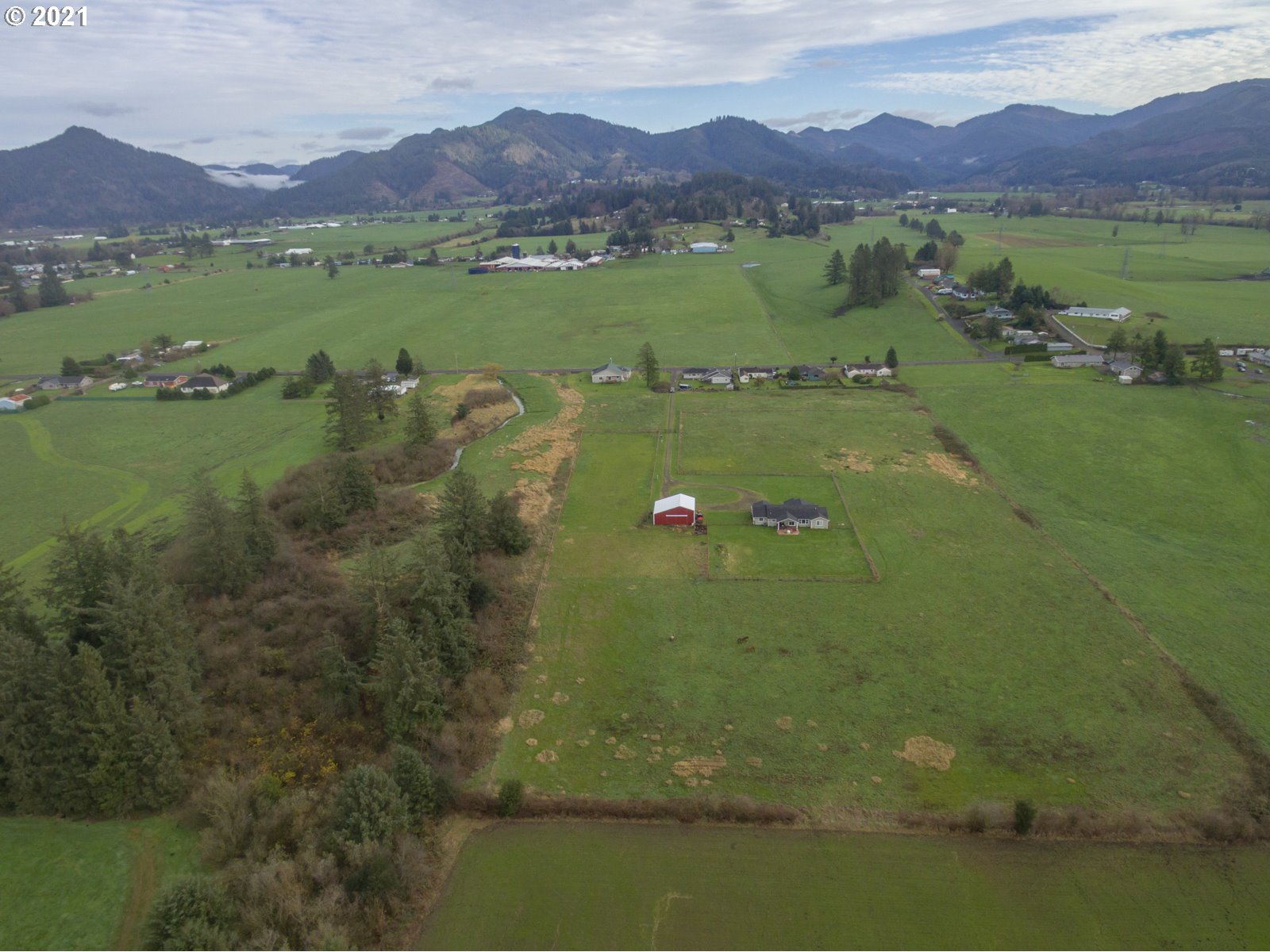1200 McCormick Loop Road Tillamook, OR 97141 - Photo 4 of 32 a view of a town with mountains in the background
