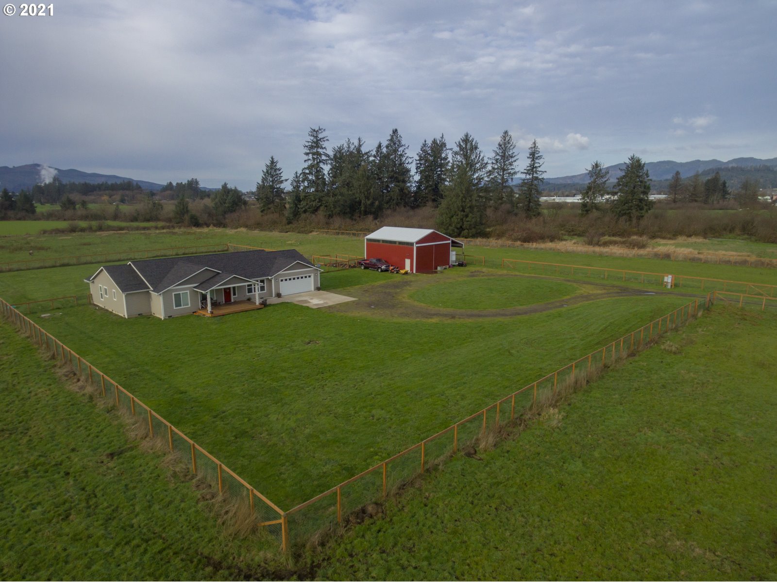 1200 McCormick Loop Road Tillamook, OR 97141 - Photo 5 of 32 a view of a golf course with a lake