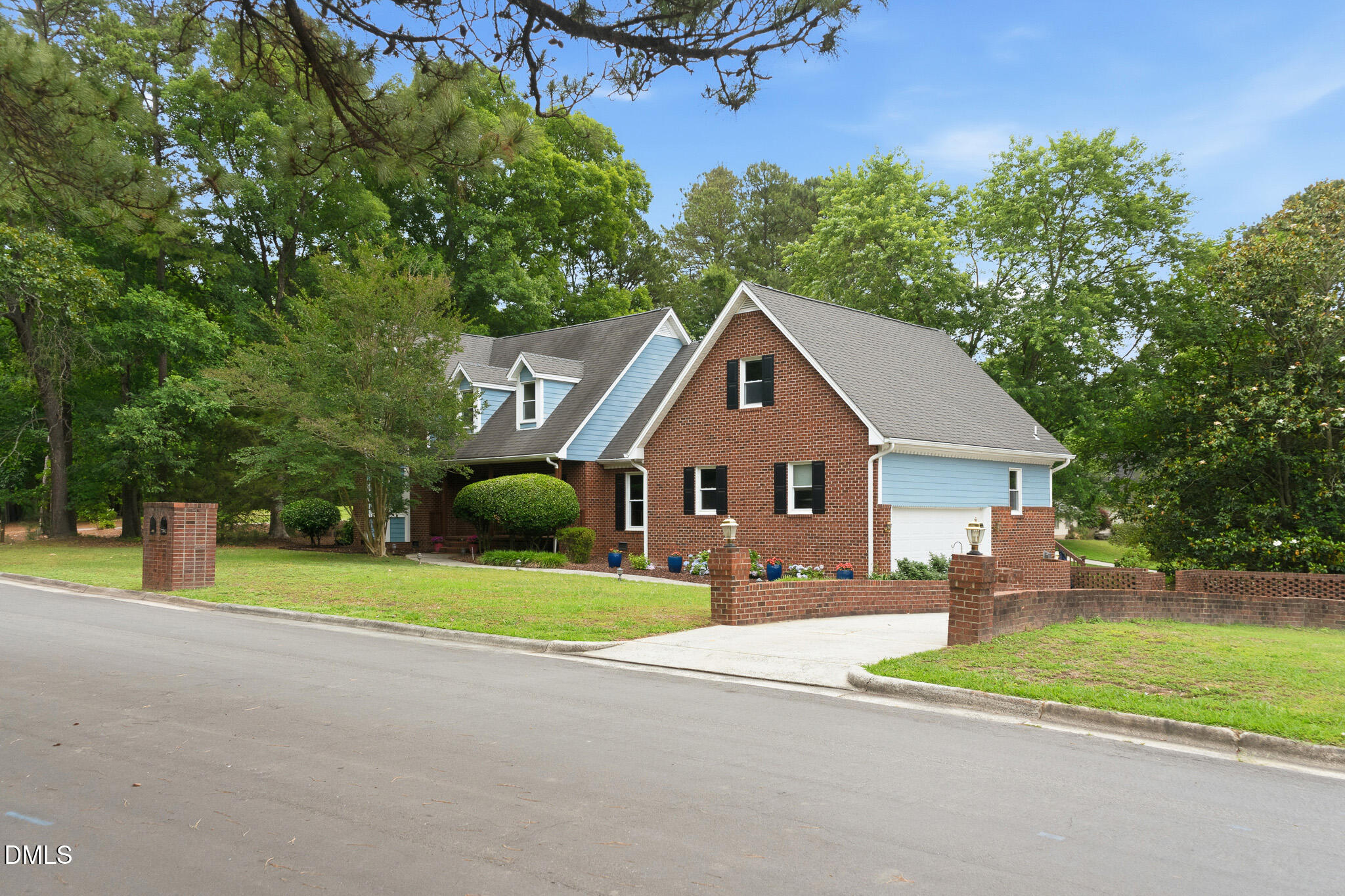 3735 Stoneybrook Drive Durham, NC 27705 - Photo 1 of 44 a view of an house with backyard and bushes