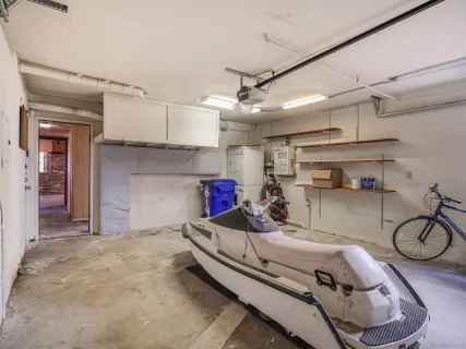 a room with a bed and cabinets