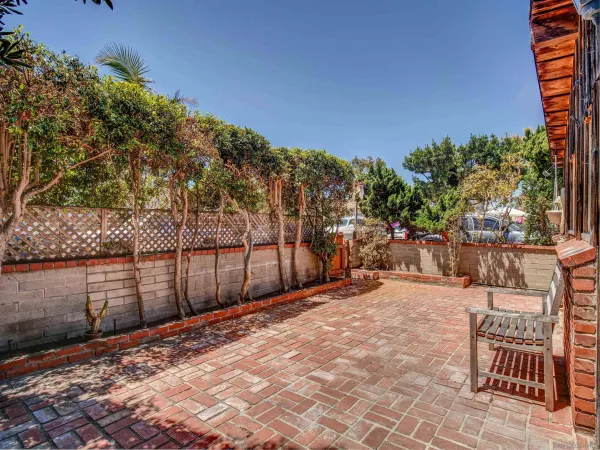a view of a backyard with sitting area