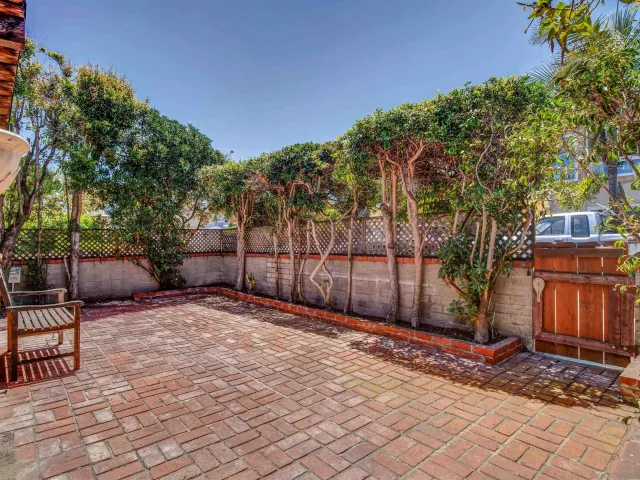 a backyard of a house with seating space