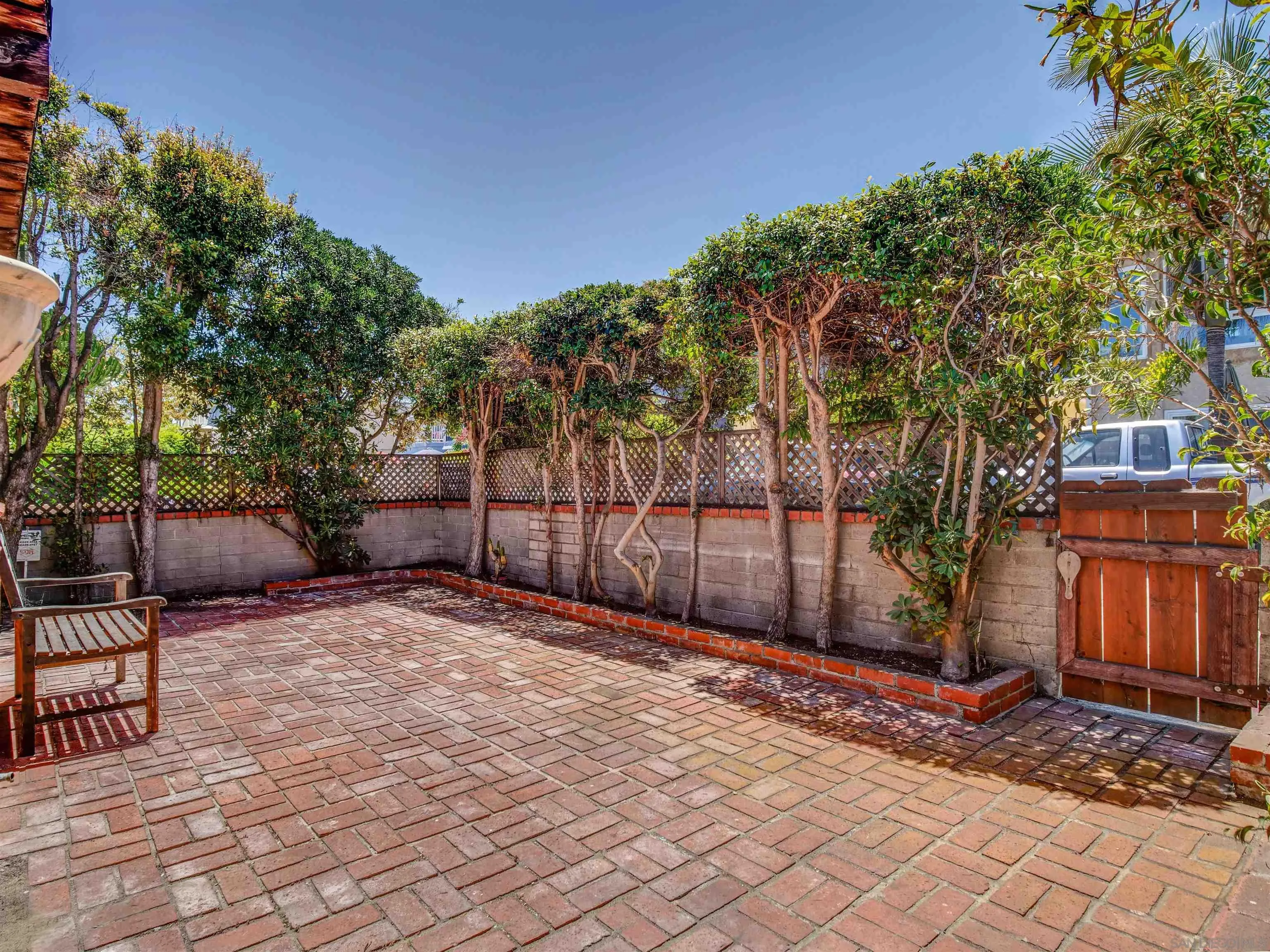 818-820 San Luis Rey Place San Diego, CA 92109 - Photo 6 of 40 a backyard of a house with seating space