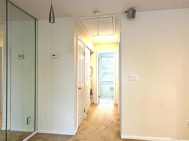 a view of walk in closet with window