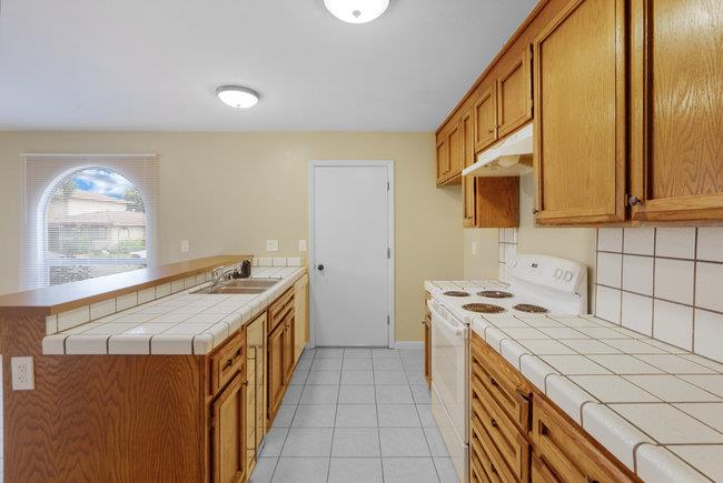 6790 Filbro Drive Gilroy, CA 95020 - Photo 15 of 42 a kitchen with a stove and a microwave
