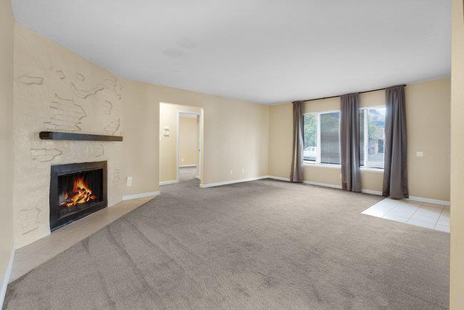 6790 Filbro Drive Gilroy, CA 95020 - Photo 10 of 42 an empty room with windows and fireplace