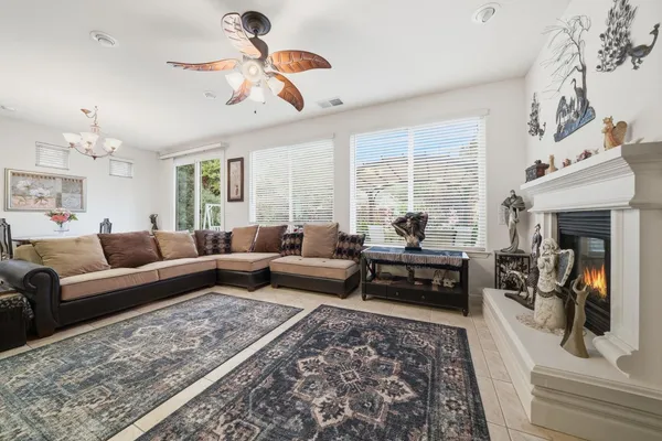 a room with a table chairs and a kitchen