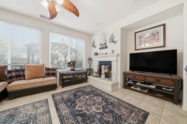 a kitchen with stainless steel appliances granite countertop a stove top oven a sink dishwasher and cabinets with wooden floor