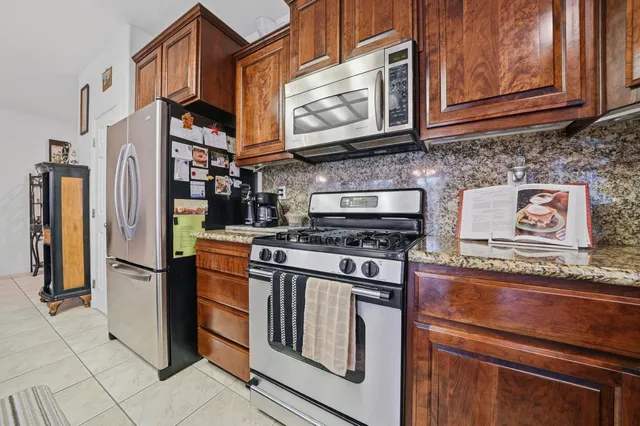 a bedroom with a large bed and a flat screen tv