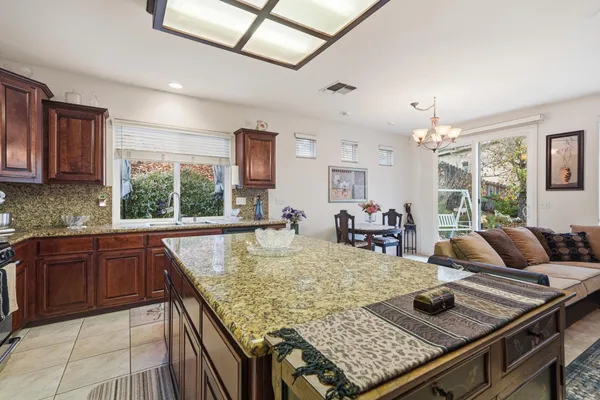 a bedroom with a bed a mirror and dresser