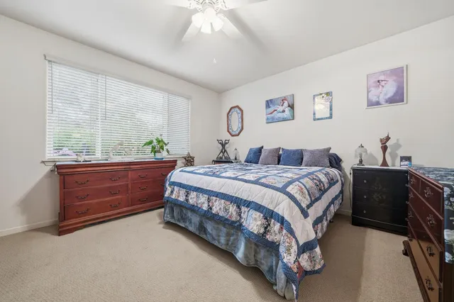 a spacious bathroom with a double vanity sink mirror double and shower