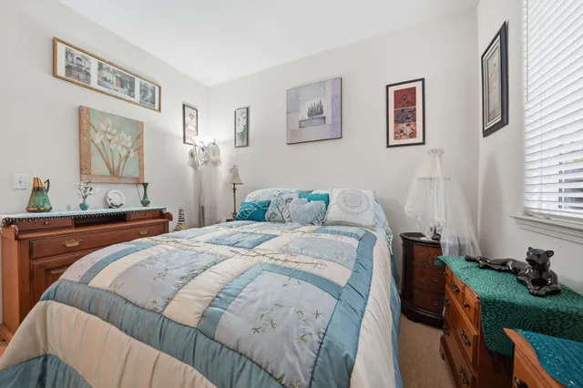 a view of a patio with table and chairs and potted plants