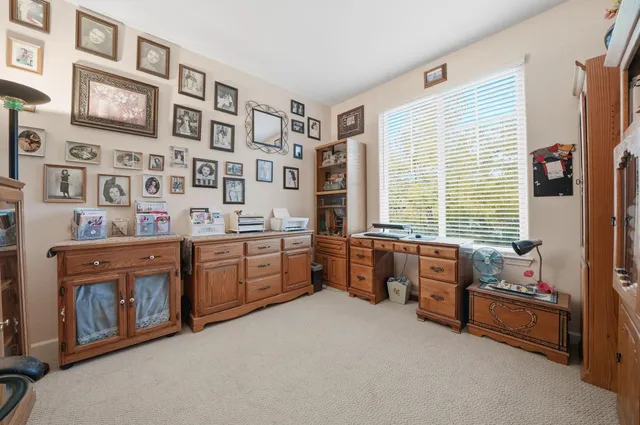 a backyard of a house with lots of green space and fountain