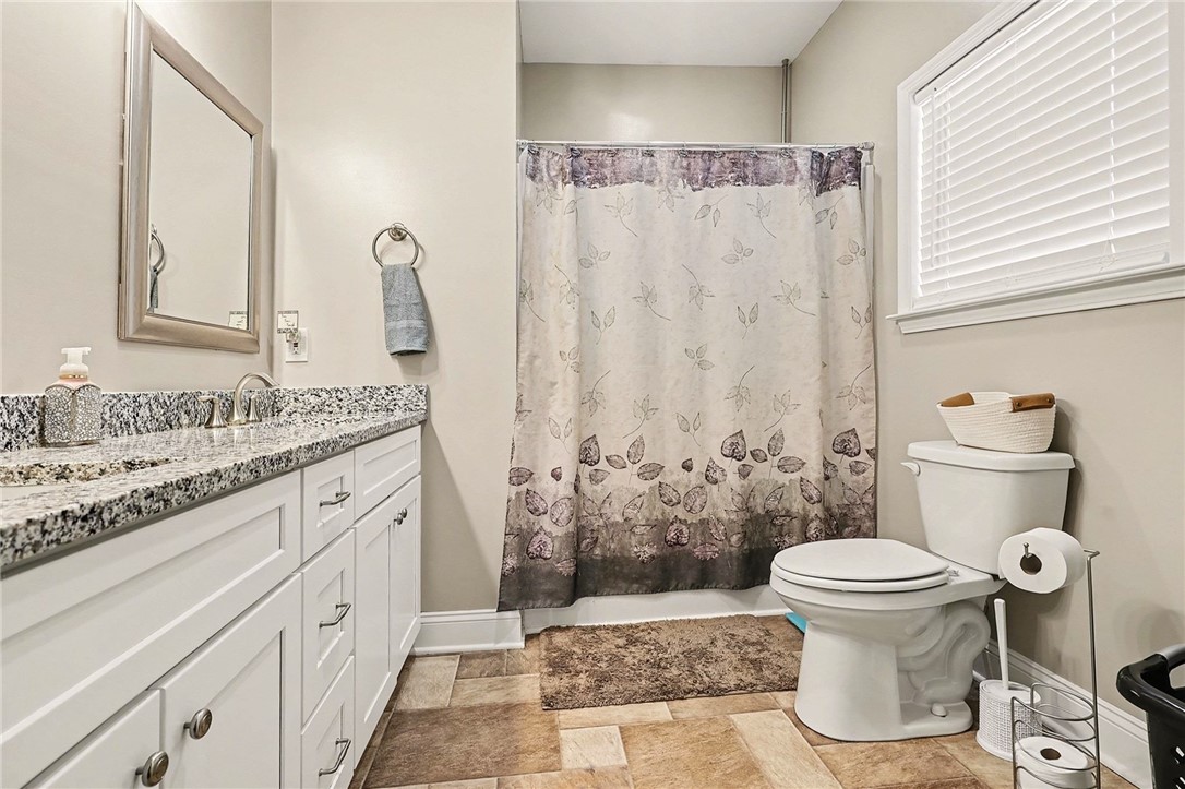508 Rice Park Drive Anderson, SC 29621 - Photo 15 of 25 This bathroom features a sleek vanity, granite countertops, and a full shower for everyday comfort.