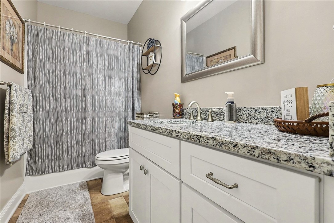 508 Rice Park Drive Anderson, SC 29621 - Photo 16 of 25 This bathroom showcases a functional vanity and a clean, accessible shower area.