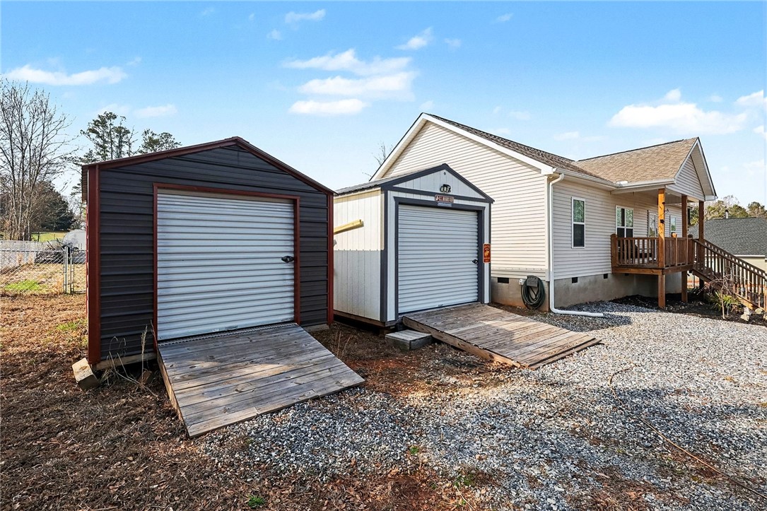 508 Rice Park Drive Anderson, SC 29621 - Photo 21 of 25 This property features multiple sheds and a comfortable patio, perfect for additional storage and outdoor relaxation.
