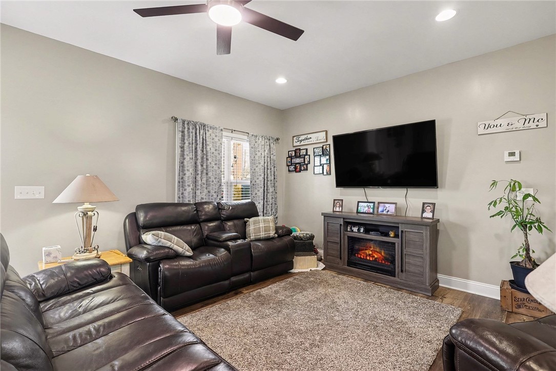 508 Rice Park Drive Anderson, SC 29621 - Photo 5 of 25 This inviting living room features a cozy fireplace and modern flooring, creating a comfortable ambiance.