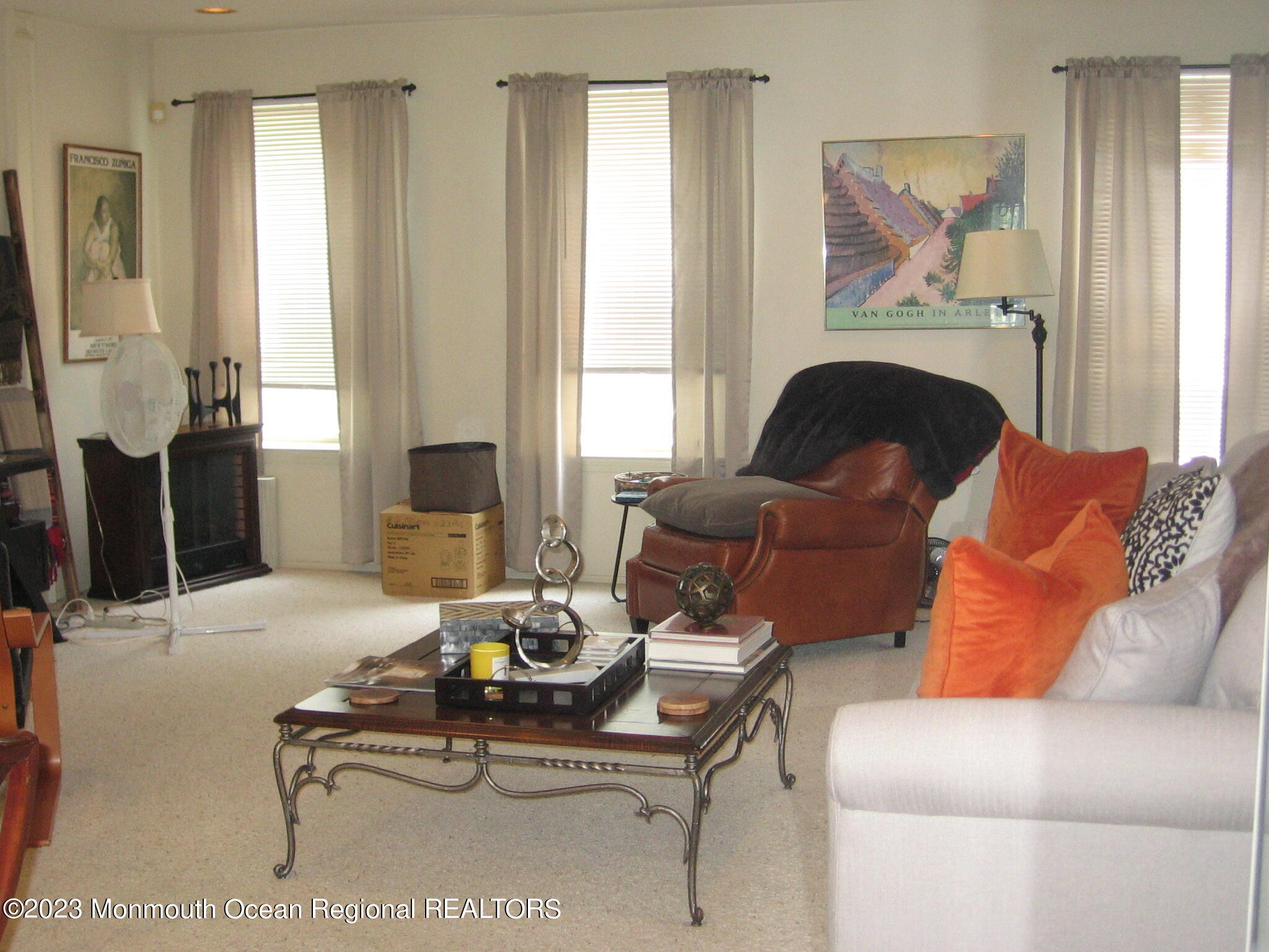 1708 Ridgeview Court, Unit 1708 Parlin, NJ 08859 - Photo 11 of 25 a living room with furniture a large window and a fireplace